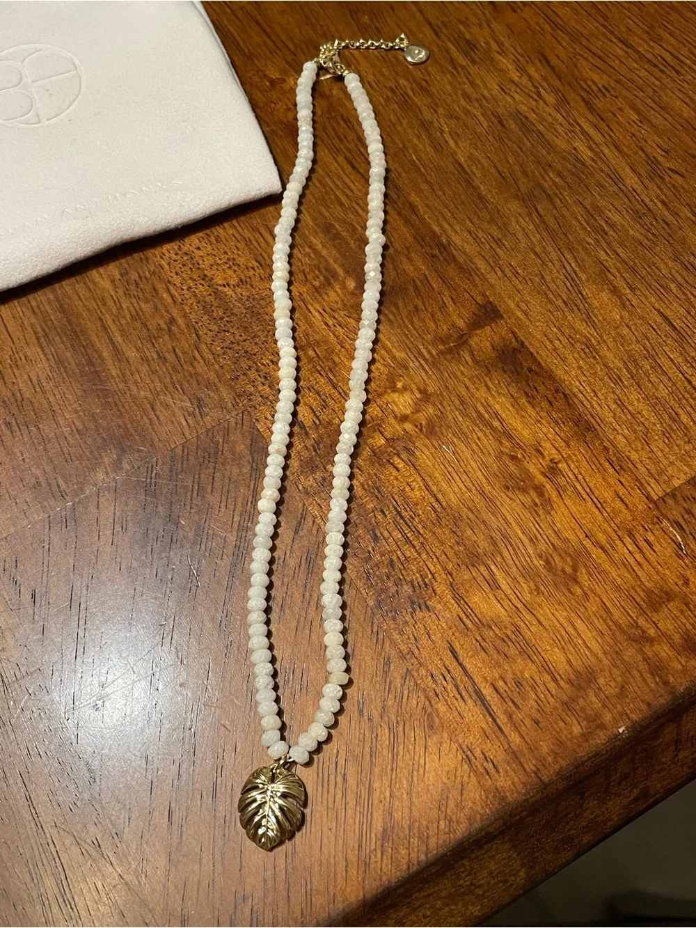 Gold Monstera Leaf Pendant Necklace with Cream Beads